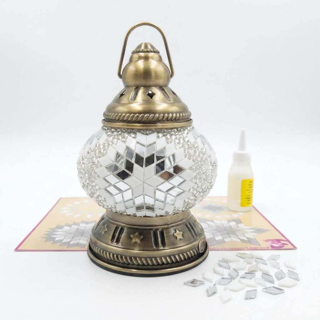 Melis mosaic lantern kit with placemat, glue and spare glass on a white background